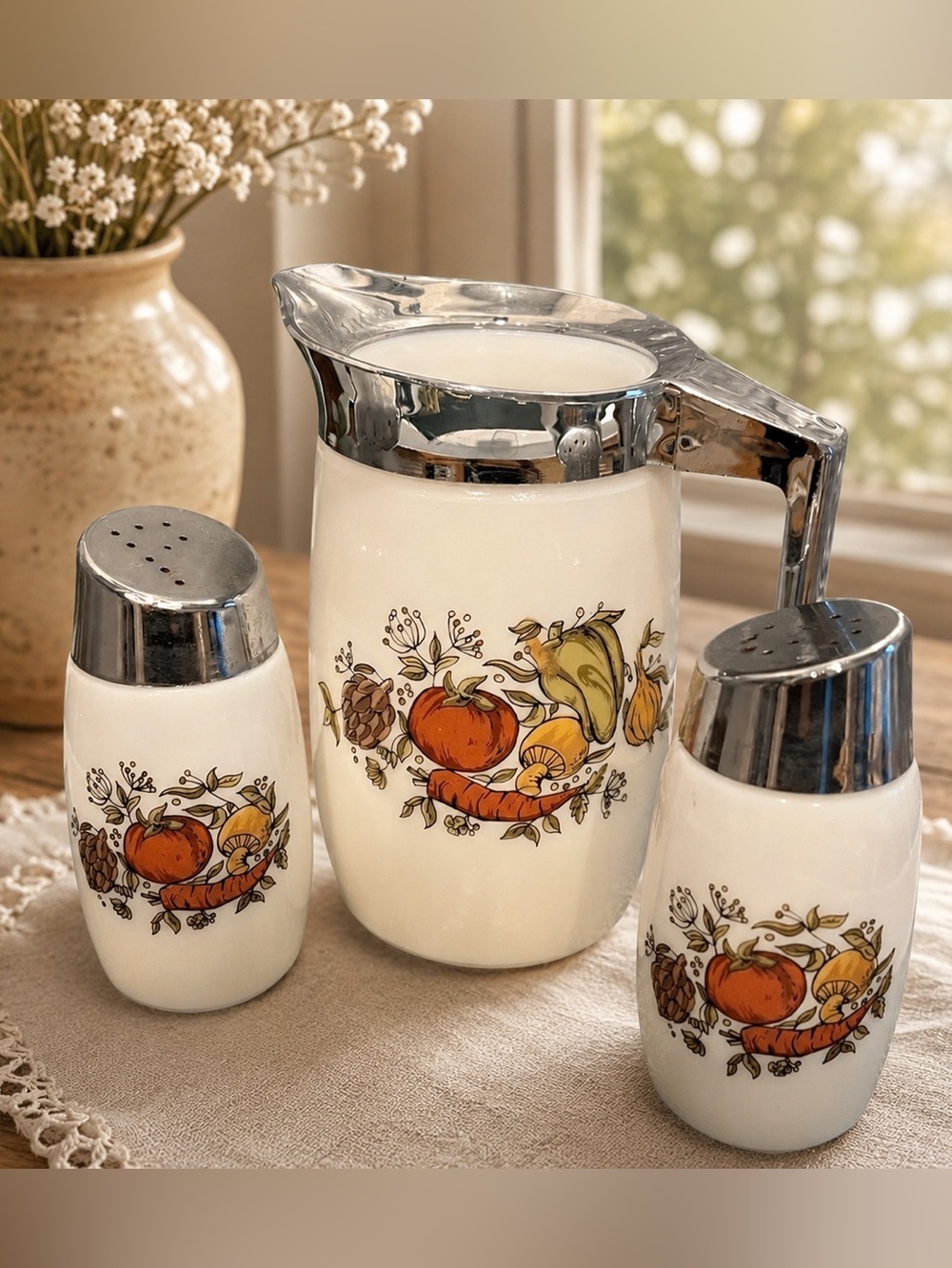 Vintage glass condiment set with chrome lids and handle.